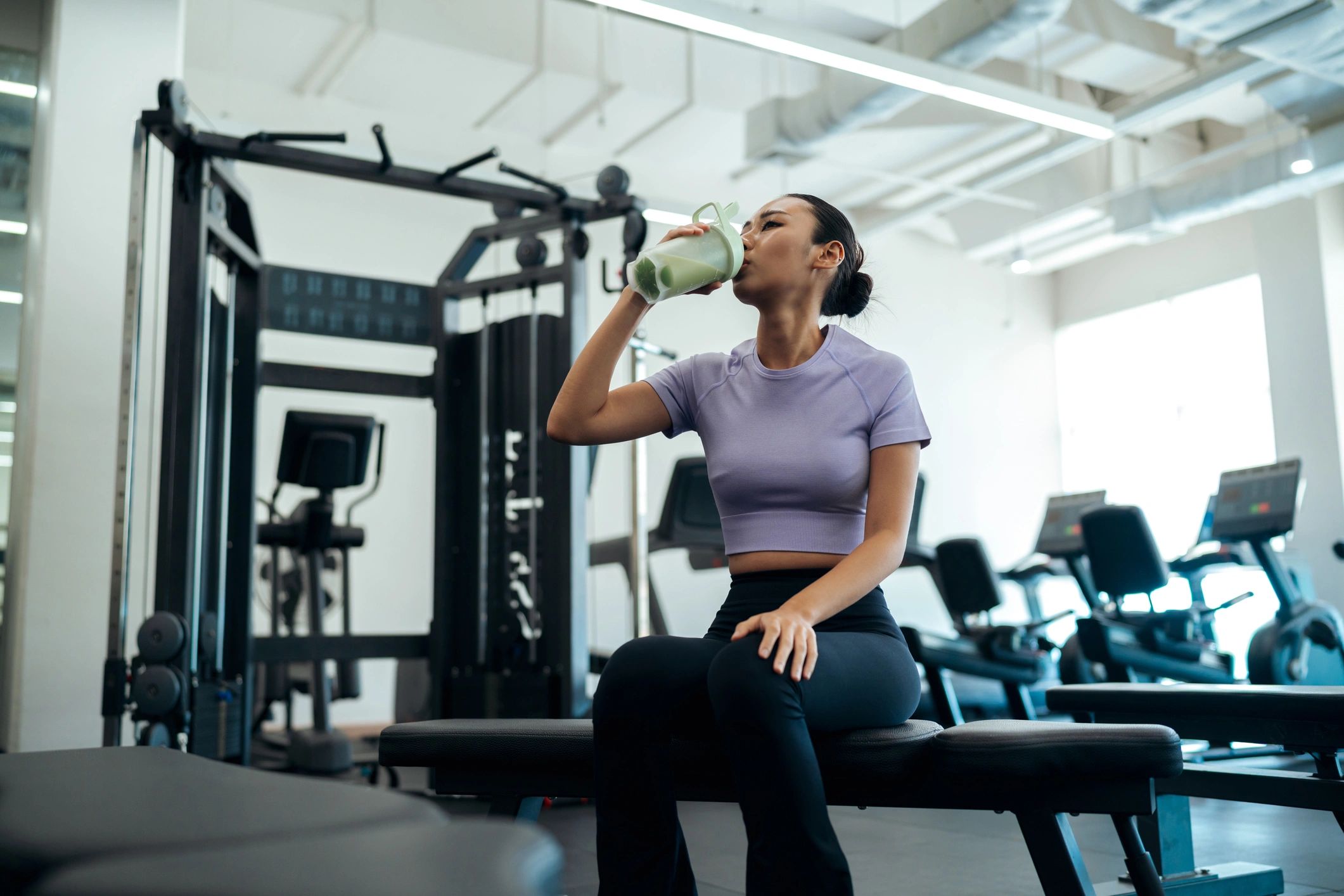 Athlete relaxing in a modern gym after training