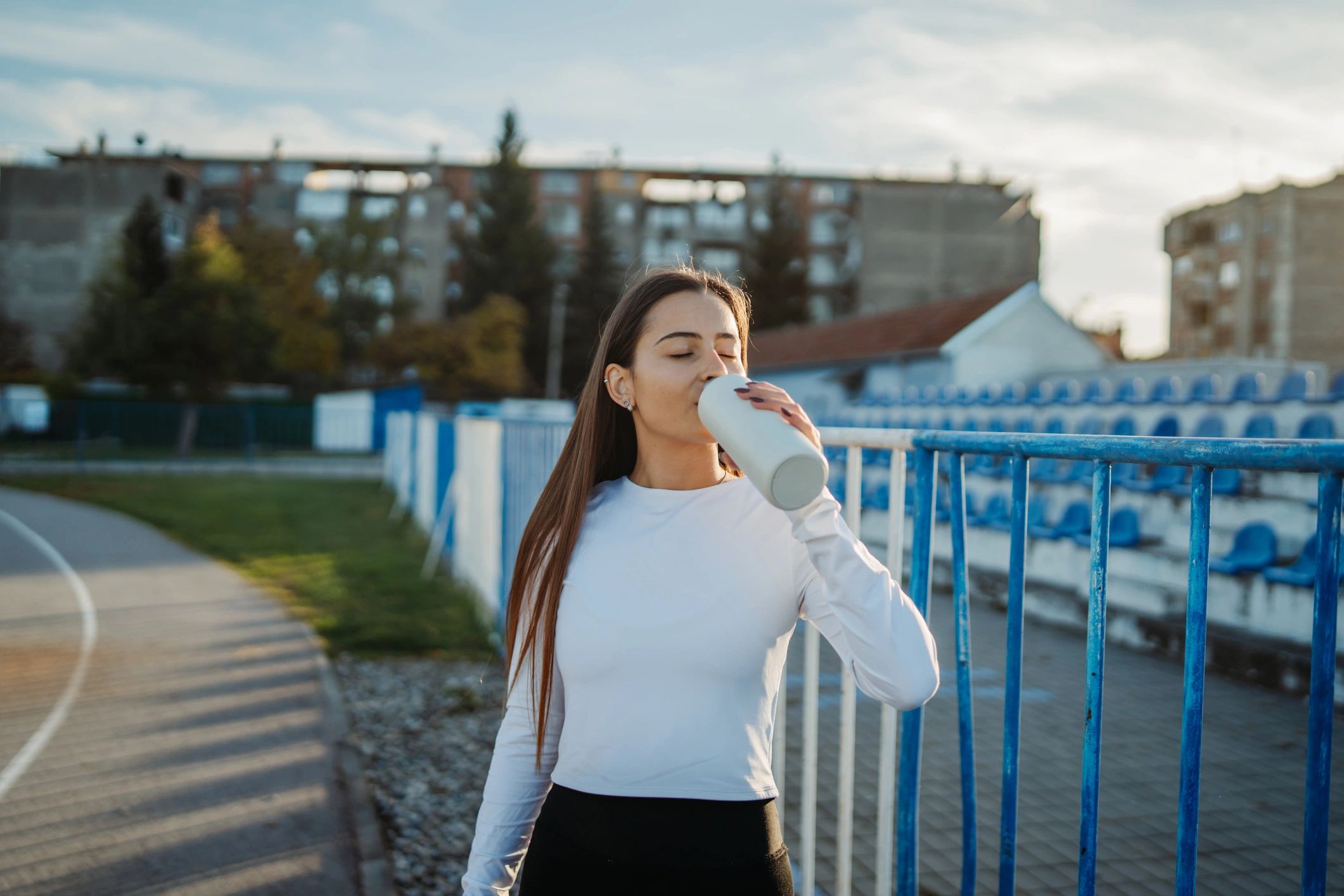 Active athlete hydrating after a workout